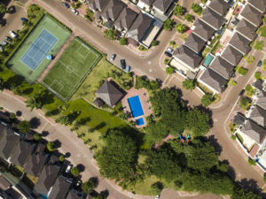 An aerial view of houses of a gated community